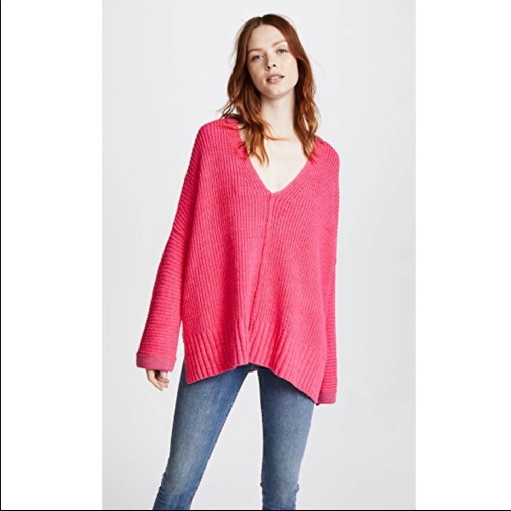 Pink V-neck Free People sweater.